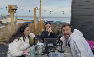 The kmfm morning crew presenters. Rob and Numi; plus producer, Becca Webb